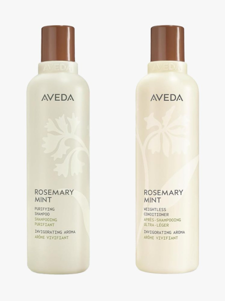 Aveda Rosemary Mint Purifying Shampoo + Rosemary Mint Conditioner in branded bottle components on a light gray background